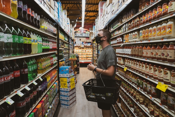 Person grocery shopping during Covid