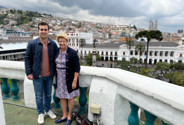 Luke Campo with Eugenie Birch against a cityscape on an overcast day