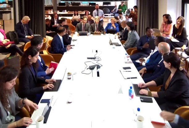 Climate Commission members gathered around table