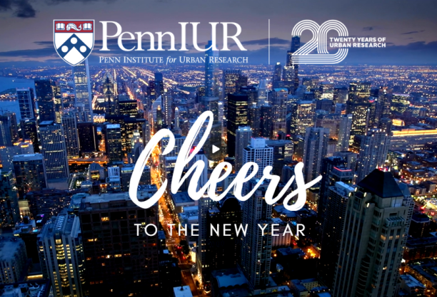 Penn IUR logo with Cheers to the new year against city aerial view