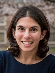 Headshot of Megan Ryerson, smiling with a dark shirt